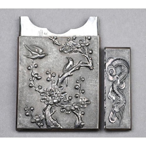 32 - A Chinese export silver card case, finely-embossed and chased with dragon and pearl, the reverse wit... 
