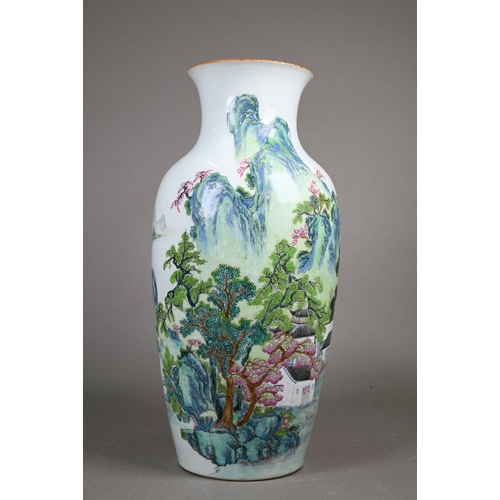 CONDITION REPORT AMENDMENT A late 19th or early 20th century Chinese famille rose vase, probably late Qing or Republic period, painted in bright polychrome enamels with figures, small dwellings and tall pine trees in an idyllic mountainous landscape, turquoise glazed interior and base with six-character Qianlong seal script mark in underglaze blue, 41 cm high