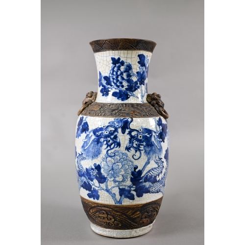 332 - A late 19th century Chinese blue and white 'dragon vase' with brown iron-dust banding and fixed ring... 