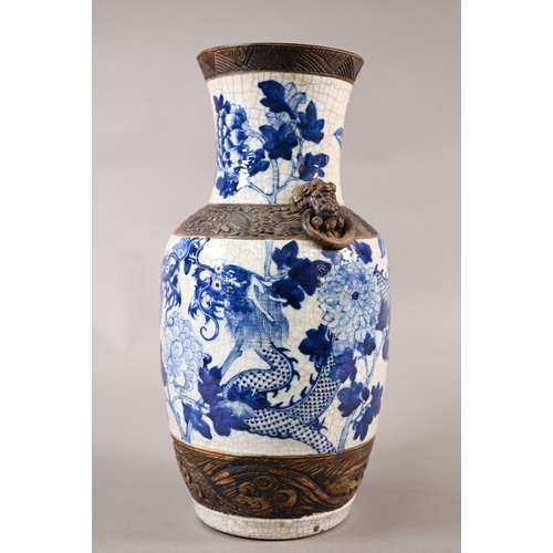 332 - A late 19th century Chinese blue and white 'dragon vase' with brown iron-dust banding and fixed ring... 