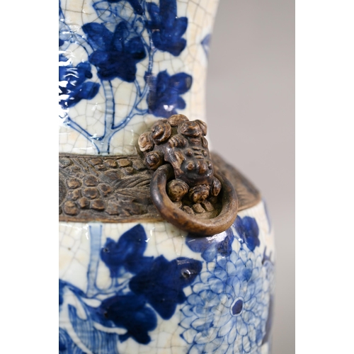 332 - A late 19th century Chinese blue and white 'dragon vase' with brown iron-dust banding and fixed ring... 