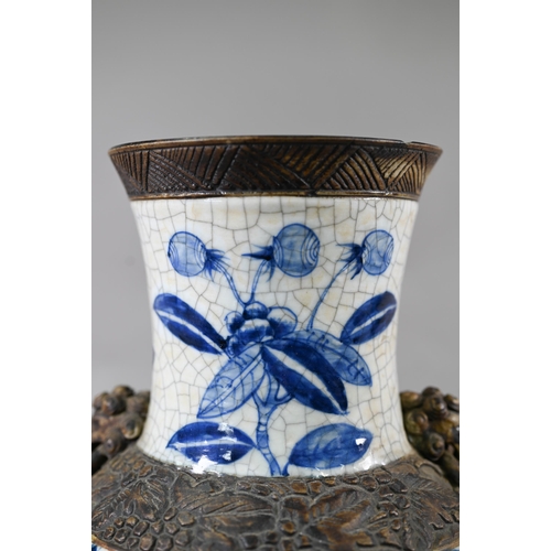 332 - A late 19th century Chinese blue and white 'dragon vase' with brown iron-dust banding and fixed ring... 