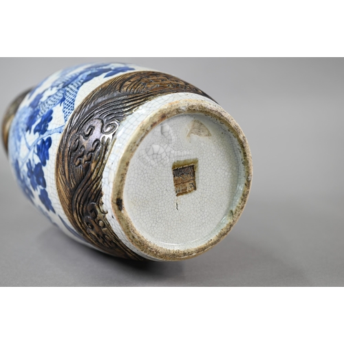 332 - A late 19th century Chinese blue and white 'dragon vase' with brown iron-dust banding and fixed ring... 