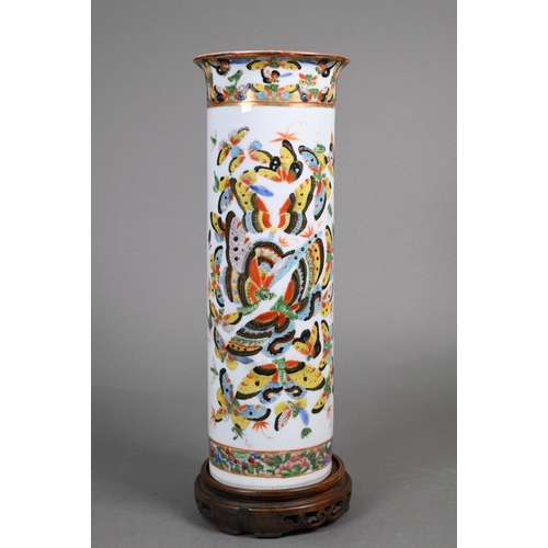 336 - A 19th century Chinese cylindrical sleeve vase painted in bright polychrome enamels with a kaleidosc... 