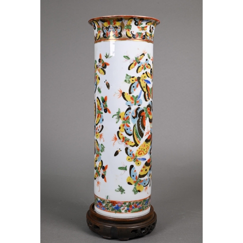 336 - A 19th century Chinese cylindrical sleeve vase painted in bright polychrome enamels with a kaleidosc... 