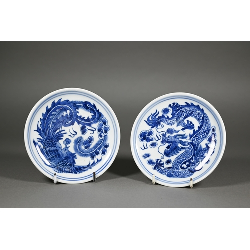 340 - A pair of Chinese blue and white circular stands or dishes, painted in underglaze blue with a dragon... 