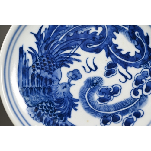 340 - A pair of Chinese blue and white circular stands or dishes, painted in underglaze blue with a dragon... 