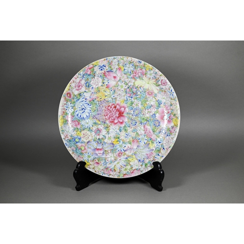 341 - A Chinese famille rose mille-fleur charger painted with floral design in bright polychrome enamels o... 