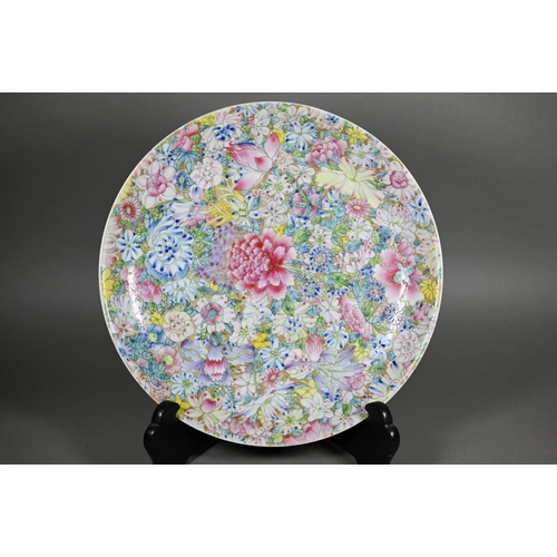 341 - A Chinese famille rose mille-fleur charger painted with floral design in bright polychrome enamels o... 