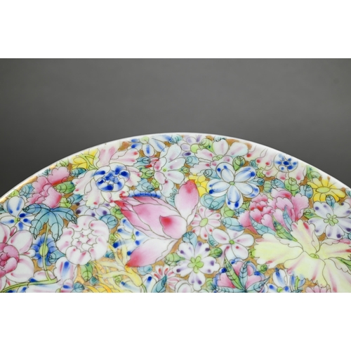 341 - A Chinese famille rose mille-fleur charger painted with floral design in bright polychrome enamels o... 