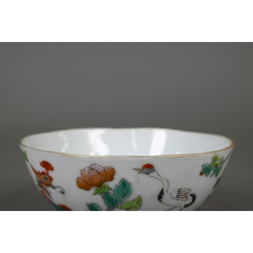 342 - A 19th century Chinese Wucai tea bowl painted with a phoenix, red-crowned crane, ducks and flowers i... 