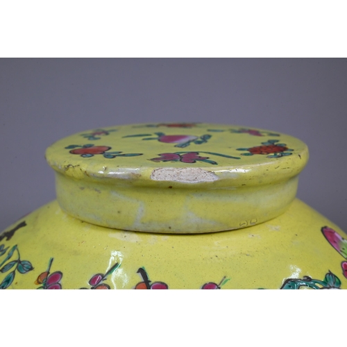 347 - A 19th century Chinese famille rose ginger jar and cover with lime-green glaze and decorated with bu... 