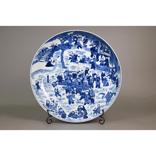 348 - A 20th century Chinese blue and white 'hundred boys' pattern charger, decorated in underglaze blue w... 