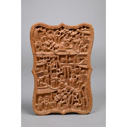 355 - A late 19th century Chinese Canton sandalwood card case, late Qing dynasty, profusely carved with a ... 