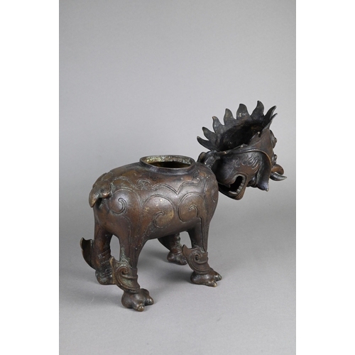 363 - A Chinese bronze Luduan-form mythical beast censer in the Yuan/Ming dynasty manner, cast standing fo... 