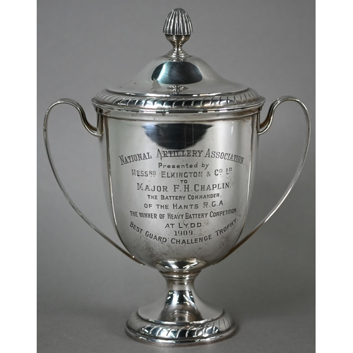 43 - An Edwardian silver two-handled trophy cup and cover on stemmed foot, Elkington & Co, Birmingham... 