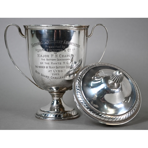 43 - An Edwardian silver two-handled trophy cup and cover on stemmed foot, Elkington & Co, Birmingham... 