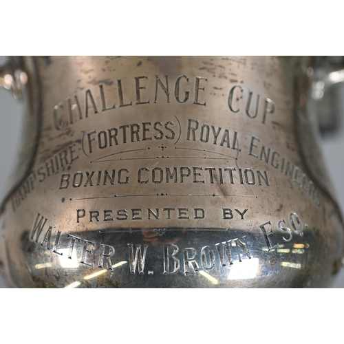 48 - A two-handled silver trophy cup on stemmed foot, London 1922, 9.2oz, 18cm high, on ebonised plinth w... 