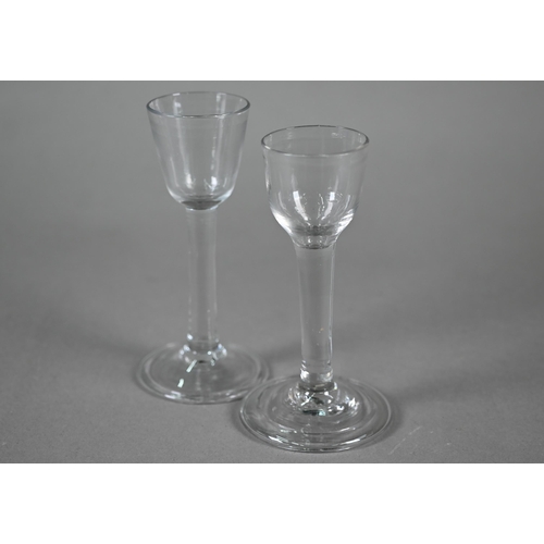 525 - An 18th Century cordial glass with ogee bowl on plain stem and folded foot, 14cm, to/w a somewhat si... 