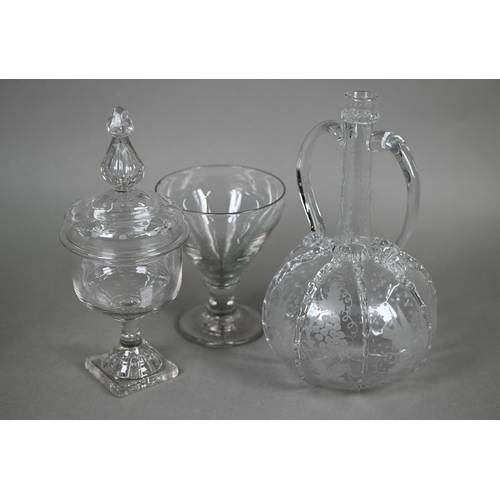 529 - An antique Dutch glass decanter with twin loop handles, applied ribbon-work and etched vine and bird... 