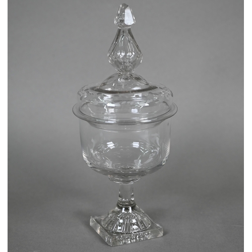 529 - An antique Dutch glass decanter with twin loop handles, applied ribbon-work and etched vine and bird... 