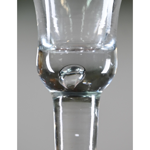 531 - A Georgian drinking glass with bell bowl, with bubble to base, plain stem and domed foot with folded... 