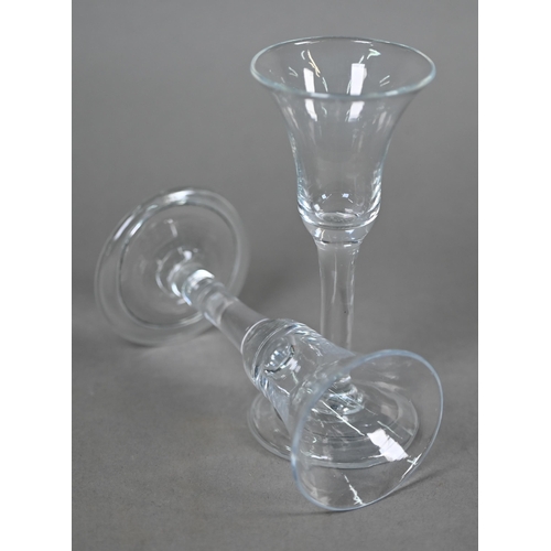 531 - A Georgian drinking glass with bell bowl, with bubble to base, plain stem and domed foot with folded... 