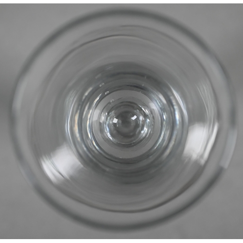 531 - A Georgian drinking glass with bell bowl, with bubble to base, plain stem and domed foot with folded... 