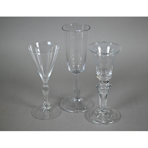 534 - An ale glass with tapering flute bowl on plain stem and domed and folded foot, 29 cm, to/w a glass w... 