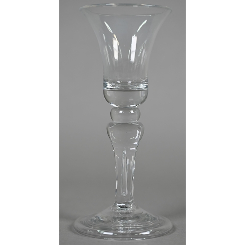 534 - An ale glass with tapering flute bowl on plain stem and domed and folded foot, 29 cm, to/w a glass w... 