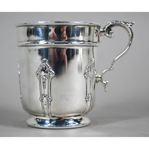 54 - A heavy quality silver Christening mug with strapwork decoration and scroll handle, Atkin Bros, Shef... 