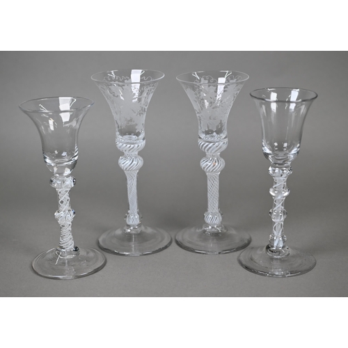 541 - A pair of drinking glasses with vine-etched bell bowls on opaque twist baluster stems, 17.8 cm, to/w... 