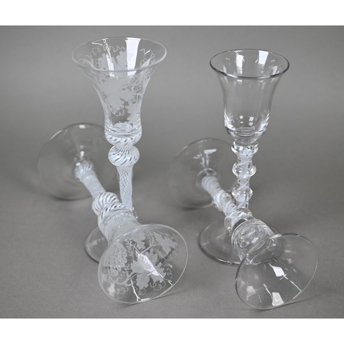 541 - A pair of drinking glasses with vine-etched bell bowls on opaque twist baluster stems, 17.8 cm, to/w... 