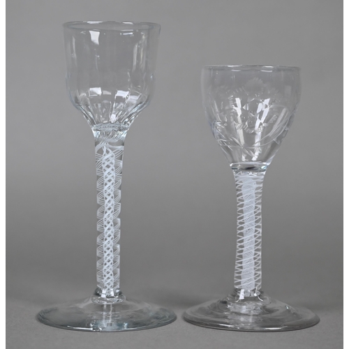 542 - A cordial glass with half-fluted ogee bowl on opaque twist stem, 15 cm, to/w another glass with flor... 