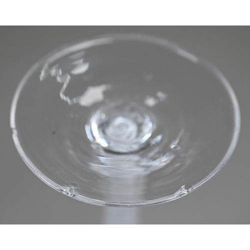 542 - A cordial glass with half-fluted ogee bowl on opaque twist stem, 15 cm, to/w another glass with flor... 