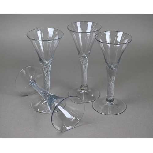 544 - Four trumpet-bowl drinking glasses on air twist stems with conical foot, 17.5 cm high approx (4)