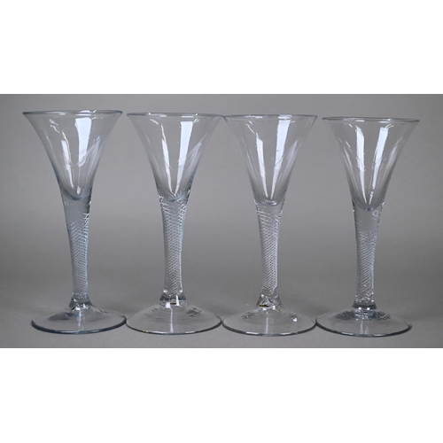 544 - Four trumpet-bowl drinking glasses on air twist stems with conical foot, 17.5 cm high approx (4)