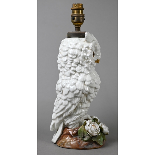 561 - A Victorian china lamp base, modelled as an owl standing on floral-encrusted base, with glass eyes, ... 