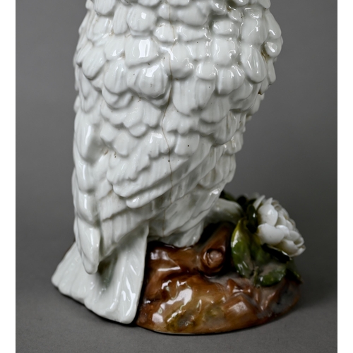 561 - A Victorian china lamp base, modelled as an owl standing on floral-encrusted base, with glass eyes, ... 