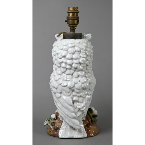 561 - A Victorian china lamp base, modelled as an owl standing on floral-encrusted base, with glass eyes, ... 