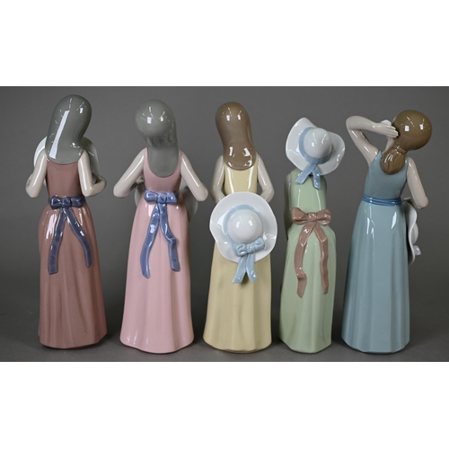 576 - Five unboxed Lladro figures of girls with hats, 13-15 cm, to/w a pair of Gres figures 'Tall' and 'Sh... 