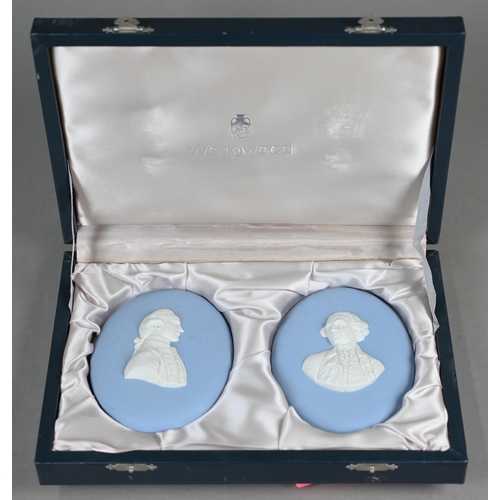 578 - A pair of Wedgwood pale blue Jasper portrait plaques of 18th century gentlemen, 13 x 10 cm, produced... 