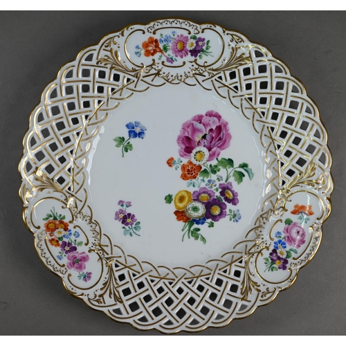 582 - Three Meissen cabinet plates, painted with floral sprays and insects within basket-weave pierced rim... 