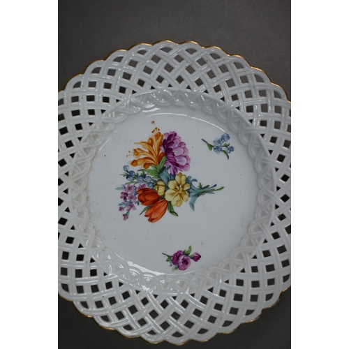 583 - Five Meissen cabinet plates, painted with floral sprays, within basket-weave lattice rims with gildi... 