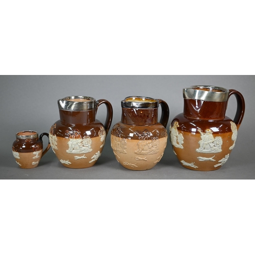 598 - Three Royal Doulton stoneware harvest jugs with silver rims, to/w a three-piece bachelor tea set and... 