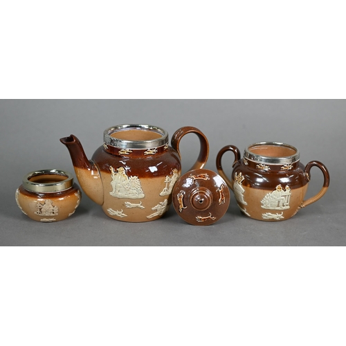 598 - Three Royal Doulton stoneware harvest jugs with silver rims, to/w a three-piece bachelor tea set and... 