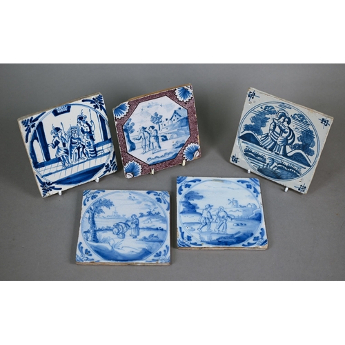 599 - Five 18th century Delft blue and white tiles, painted with figures - two Biblical subjects, the othe... 