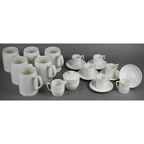 601 - Keith Murray for Wedgwood: a set of six cream glazed pint beer-mugs, 12 cm high, to/w a set of six c... 