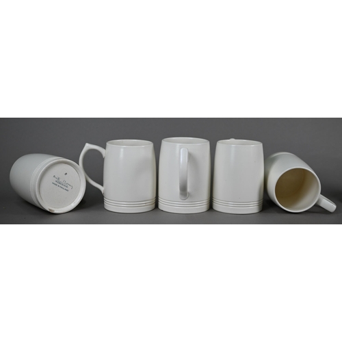 601 - Keith Murray for Wedgwood: a set of six cream glazed pint beer-mugs, 12 cm high, to/w a set of six c... 