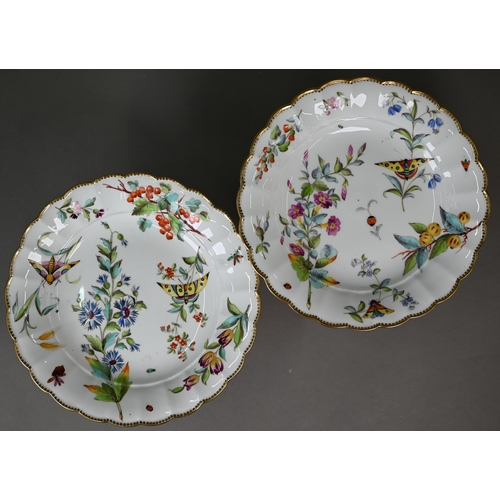 603 - An early 19th century Staffordshire china dessert service, finely-painted with floral specimens, fru... 